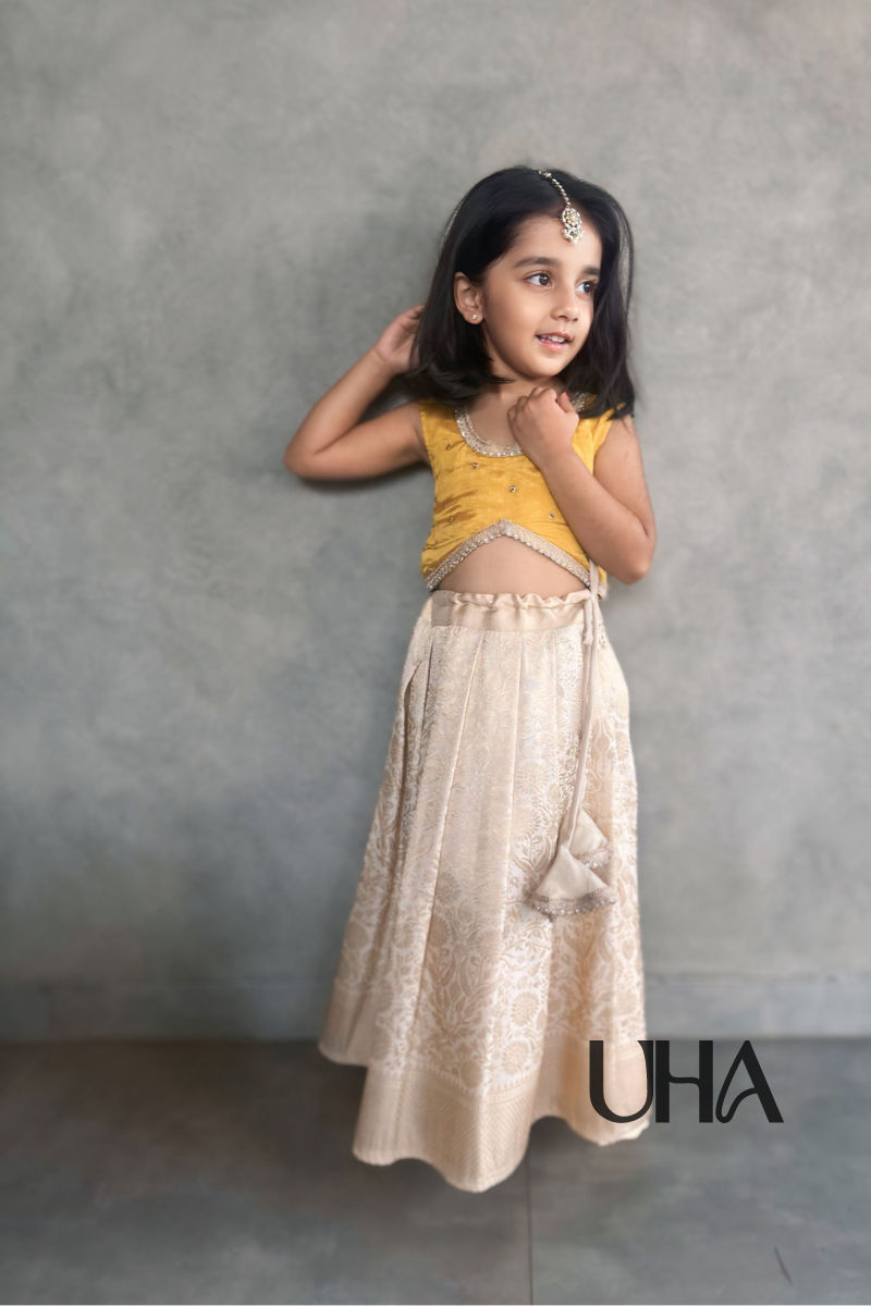 Girls Beige Silk Lehenga And Yellow Blouse